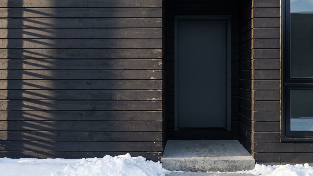 Dark stained cedar exterior on Scandi style custom home near Lake Minnetonka Minnesota