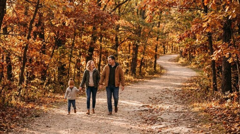 Family hiking a wooded fall trail at a Minnetonka, MN city park